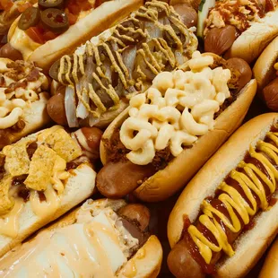 a pile of hot dogs with macaroni and cheese
