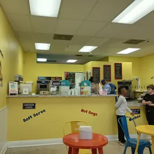 two people standing at the counter