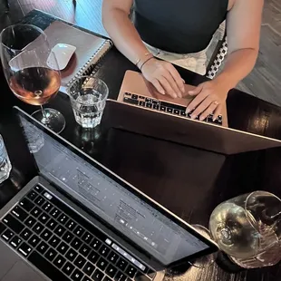 a woman typing on a laptop