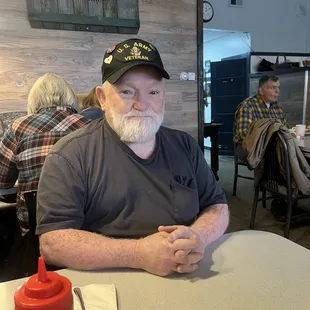 My dad waiting briefly before enjoying his delicious lunch!