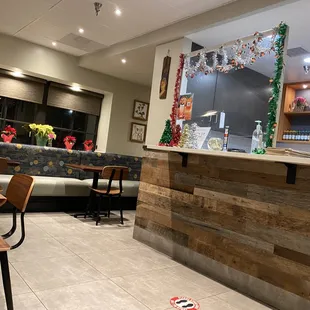 a restaurant with a counter and chairs