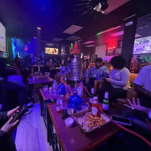a group of people sitting around a table