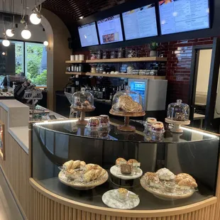 Dilettante Mocha Café Pastry case featuring cupcakes, cookies, scones, croissants, and brownies