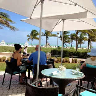 Table with a view of Beach, Ocean &amp; Promenade.