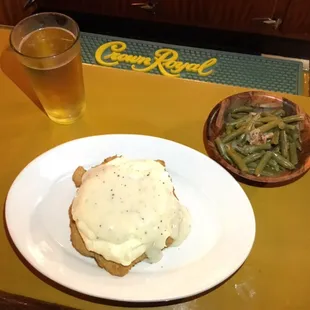 Every Wednesday country fried steak  comes mashed potatoes and gravy served Manhattan style with green beans for ~ $8