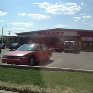a red car in a parking lot