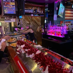 a bartender serving customers