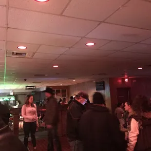 a group of people standing in a room