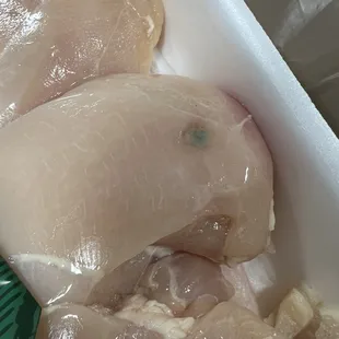 &quot;Fresher than Fresh&quot; chicken I just bought. Couldn&apos;t see that wonderful little spot because the label covered it up.