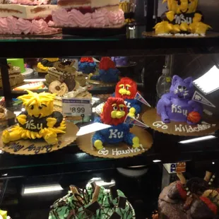a display case of cakes and pastries