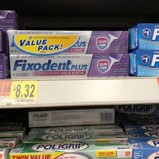 a variety of toothpaste products on a shelf