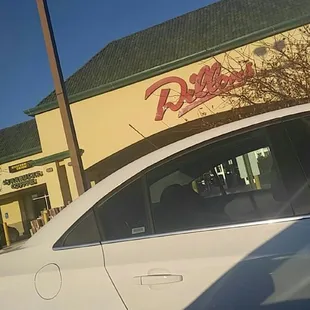 a car parked in front of a restaurant