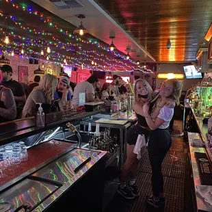 a group of people at a bar