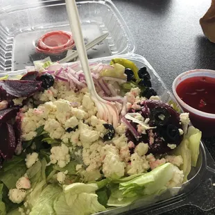 a salad in a plastic container