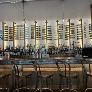 rows of wine bottles on the wall