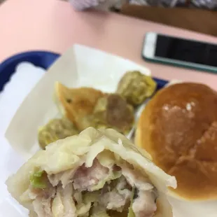 Pork dumplings, pork sui mai, and BBQ pork bun! Dumplings were great, BBQ pork bun was cold and not that good