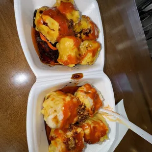 two take out containers of food