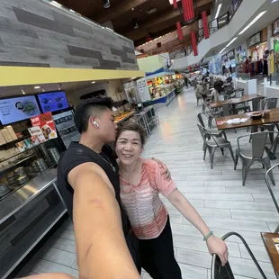 a man and a woman taking a selfie
