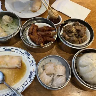 Xiao Long Bao, chicken feet, steamed spare ribs, rice noodle roll stuffed with shrimp, shrimp dumplings, and steamed pork bun