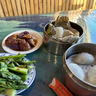 Stuffed eggplant, Chinese broccoli with oyster sauce, lotus wrapped sticky rice and shrimp and chive dumplings