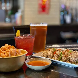 a bowl of food and a glass of beer