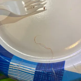 Check out this cool hair I found in my hot sauce I had to buy since they&apos;re so cheap they charge you for hot sauce and soy saice