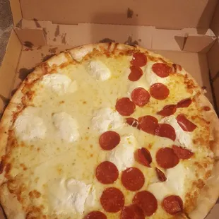 16" white with half pepperoni $15.50. Very greasy.