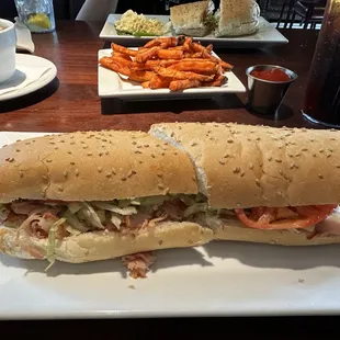 Turkey poboy, sweet potato fries, gumbo--combo in the back. Great service. Great food.