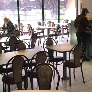 Clean, open dining area with a nice view.