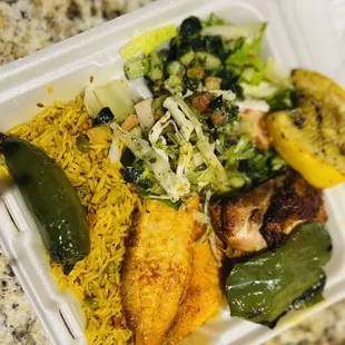 Buffet To go plate; Baked Fish, rice, Greek salad, baked chicken, Cabbage Salad, peppers, and squash.