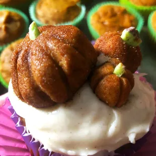 a cupcake with a pumpkin on top