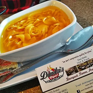 a bowl of soup and a spoon