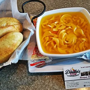 a bowl of soup and bread