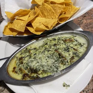 The amazing,  homemade,pizza oven baked Spinach Artichoke dip with fresh crispy "made to order" tortilla chips.