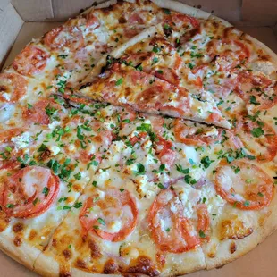 Roma tomatoes, red onion, fresh basil, mozzarella, French feta cheese, and Italian parsley