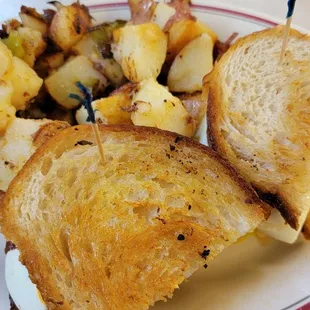 Ultimate breakfast.  Sandwhich with a side of potatoes