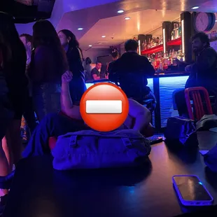 back of the club near the door
