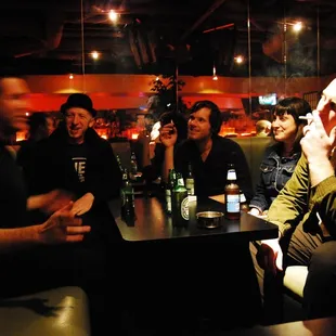 a group of people sitting around a table