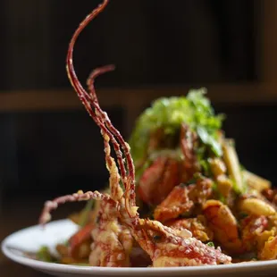 a plate of food with shrimp and broccoli