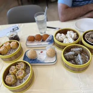 a variety of dim dimsums on a table