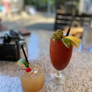 two cocktails on a table