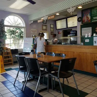 ows a restaurant with tables and chairs