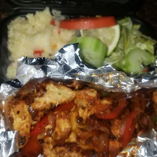 Fajitas de pollo, mushy rice and no beans.