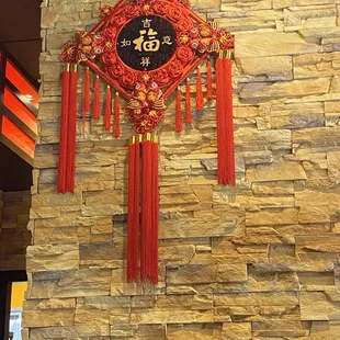 a clock on a stone wall