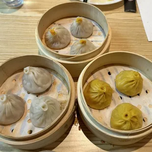 Clockwise from bottom left: Pork soup dumplings, Crabmeat &amp; pork soup dumplings, Chicken soup dumplings