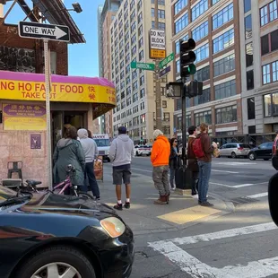 people waiting to cross the street