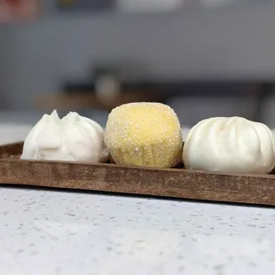 Bao Trio Sampler. Contains BBQ Pork, Ginger Mushroom Chicken and Snow Mountain Molten Lava buns.