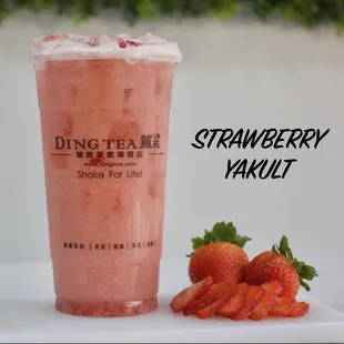 a strawberry milkshake and strawberries