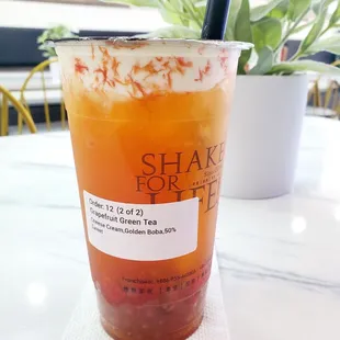 Grapefruit green tea with cheese foam and honey golden boba