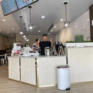 a man standing behind a counter